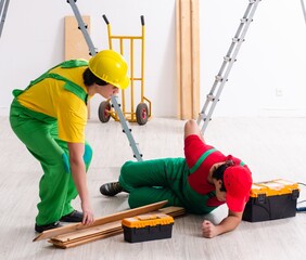 Wall Mural - Injured worker and his workmate