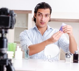 Wall Mural - Young handsome man recording his blog in hygiene concept