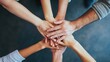© redflower - Hands Stacked Together Representing Unity and Cooperation