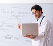© Elnur - Young male doctor neurologist in front of whiteboard