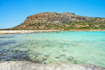 Breathtaking landscape of coast of Mediterranean sea with mountains - Crete, Greece. Beautiful, clear, blue sky and water.