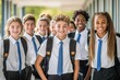 © BogdanNikolic - A group of happy young students in uniform posing for the camera outside their school