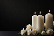 © Amila Vector - White Candles and Flowers on Black Panoramic Background Solemn and Respectful Atmosphere for Funeral Service, Memorial, or Obituary Headers