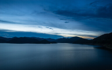 Scenic sunset blue hour mountains and lake