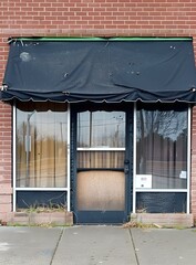 Sticker - Black Awning Over A Store Front With A Brick Facade