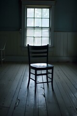 Canvas Print - A Single Chair In A Room With A Window