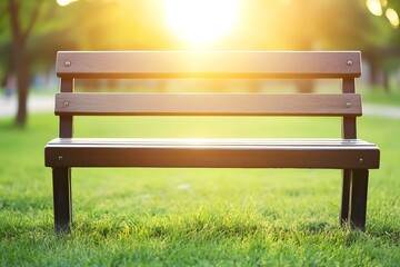 Poster - Empty Wooden Bench In A Green Grass Field At Sunset