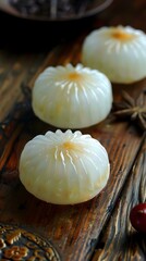 Wall Mural - Closeup of Three White Dumplings on a Wooden Cutting Board