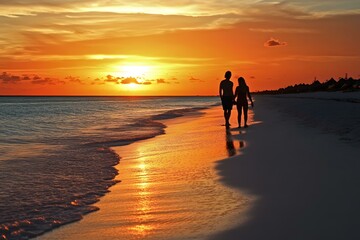 Wall Mural - Silhouette of Couple Holding Hands Walking on Beach at Sunset