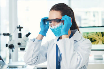 Microscope, scientist and pathology in research laboratory for medicine, biology and pharmaceutical in Denmark. Female person, doctor and tech with ppe mask for investigation, science or mpox vaccine