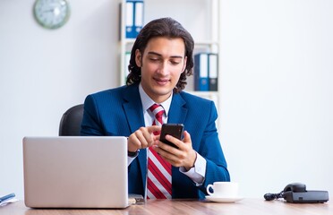 Poster - Young male businessman working in the office