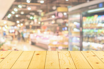 Sticker - Empty wood table top with supermarket blurred background for product display