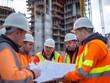© LookChin AI - A Group of Construction Workers Examining Blueprints on a Bustling Construction Site