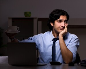 Wall Mural - Young handsome employee and too much work in the office