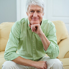 Canvas Print - Smile, relax and portrait of elderly man on sofa in home with confidence, wellness and retirement. Happy, calm and senior person on couch in living room with pride, peace and weekend in apartment