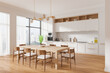 © ImageFlow - Modern kitchen with wooden dining table and chairs. 3D Rendering