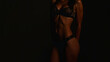 © overrust - female body in underwear in dark atmosphere