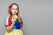 © millaf - Young girl wearing snow white dress, Halloween concept