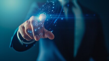 Canvas Print - A man in a suit is pointing at a computer screen with a blue background