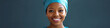 © Lila Patel - Female African American health care worker in scrubs, smiling at camera