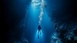 © Bussakon - Diver exploring a deep sea trench illuminated by their flashlight ocean and marine life concept with copy space