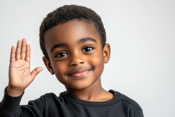 A smiling African American boy with a joyful expression, showing