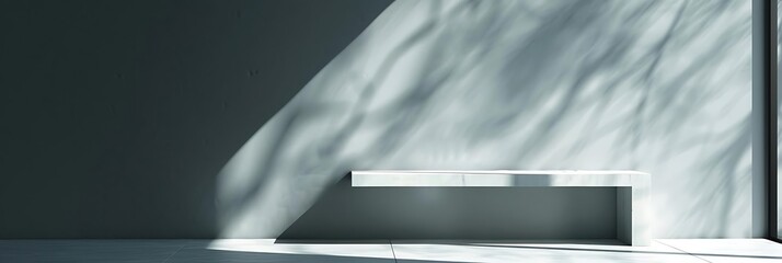 Canvas Print - A minimalist interior space with a sleek bench and soft light creating shadows on the wall.