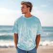 © Alena - Ocean color tshirt front view mockup. Young man model in blue oversized short sleeve crewneck tee at the beach. Men's basic outfit,  comfort colors shirt mock up, vacation, sea, ocean holidays