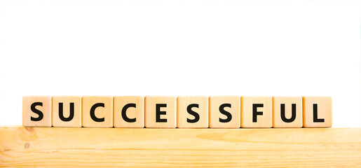 Successful symbol. Concept word Successful on beautiful wooden blocks. Beautiful white background. Business successful concept. Copy space.