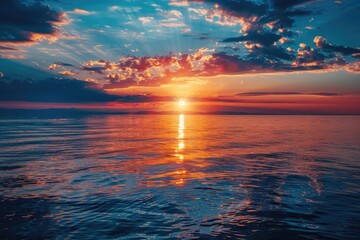 Poster - A serene scene of sunset over the ocean on a cloudy day, perfect for use in travel or nature-related contexts