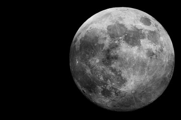 Wall Mural - Behold the stunning full moon that shines brightly against the dark, expansive night sky