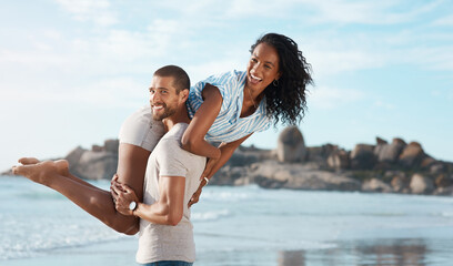 Wall Mural - Couple, portrait and honeymoon at beach for travel, summer and tropical holiday together in San Diego. Man, woman and carrying on sand by ocean for adventure, love and relax on vacation with partner