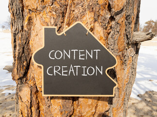 Time for content creation symbol. Concept words Content creation on beautiful black house blackboard. Beautiful tree background. Business time for content creation concept. Copy space.