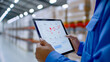 © TH_Stock - Warehouse worker analyzing data on tablet in storage facility, monitoring logistics and inventory statistics for efficient management.