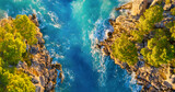 Drone view of the sea coast. Rocky shore and sea water. Vacation and travel. Summer seascape. aerial view. Image for cards, background, wallpaper or design.