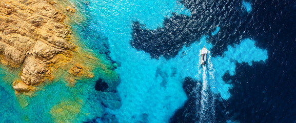 Wall Mural - drone view of a motor boat and sea shore. vacation and holidays. summer time for sea travel. the sea