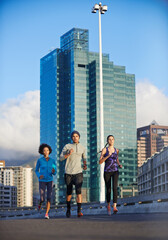 Poster - City, road and people running together for fitness, training or commitment to healthy body. Morning, exercise and group of friends on street for urban workout, outdoor challenge or sports performance