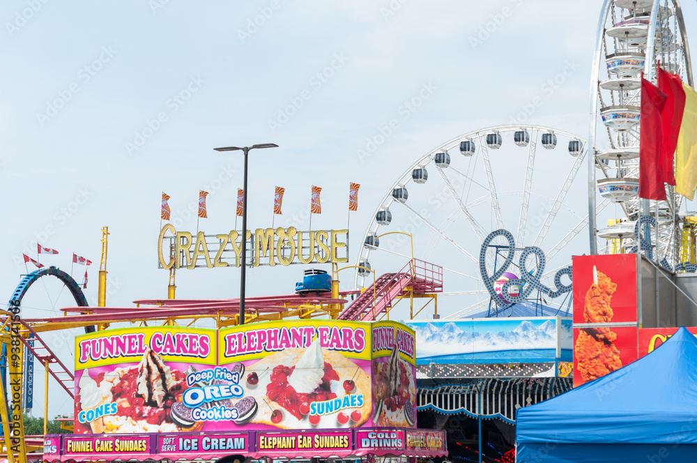 wide-view of rides (Crazy Mouse, Polar Express, Ferris wheel) and food ...