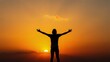 © Siwapong - Silhouette of a Person Welcoming the Sunset. Golden hour.