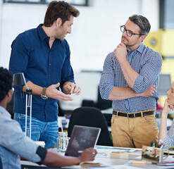 Aufkleber - Group, ideas and mature man in office, creative and talking for project, thinking and suggestions. People, web designer and laptop for brainstorming, teamwork and boss with employees for deadline