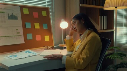 Aufkleber - businesswoman working late in her office reviews paperwork while feeling tired and stressed. meeting