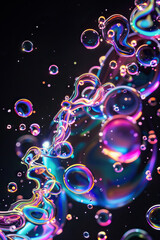 Vibrant liquid bubbles of various colors against a black background, creating a mesmerizing and colorful display.