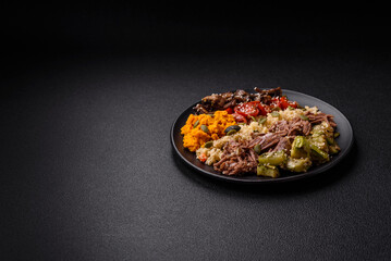 Wall Mural - Bowl of food with beef, bulgur, tomatoes, mushrooms, zucchini