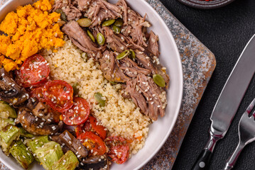 Wall Mural - Bowl of food with beef, bulgur, tomatoes, mushrooms, zucchini