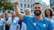 © Pinklife - A cheerful healthcare worker in blue scrubs raises his fist in a sign of victory and solidarity, with a group of colleagues in the background, symbolizing teamwork and triumph.