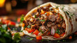 © HaiderLion - fresh homemade burrito with savory meat and vegetable filling on rustic table