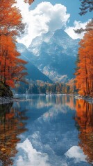 Wall Mural - Tranquil lake reflects towering mountains and vibrant autumn trees under a blue sky with scattered white clouds