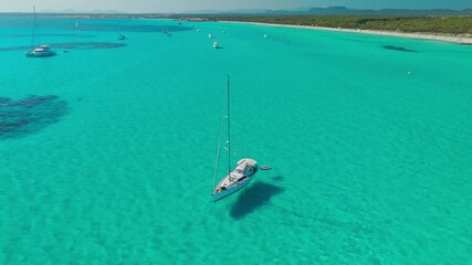 Wall Mural - Beautiful sailboat is moored in the incredible turquoise waters of Mallorca