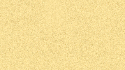 a seamless texture of slightly textured colored paper in pastel gold color