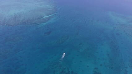 Wall Mural - Drone, landscape and ocean with nature, boat and water with summer adventure, environment and top view with travel, blue world and tropical island. Aerial, sailing and cruise to land with vacation